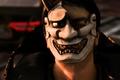 A masked assailant from Like a Dragon Gaiden: The Man Who Erased His Name